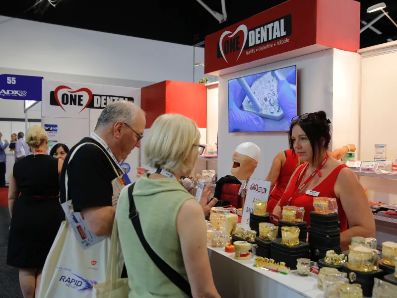Woman entertaining clients showing dental products