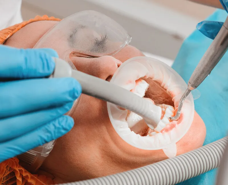 Doing a dental ultrasound procedure at a dental clinic