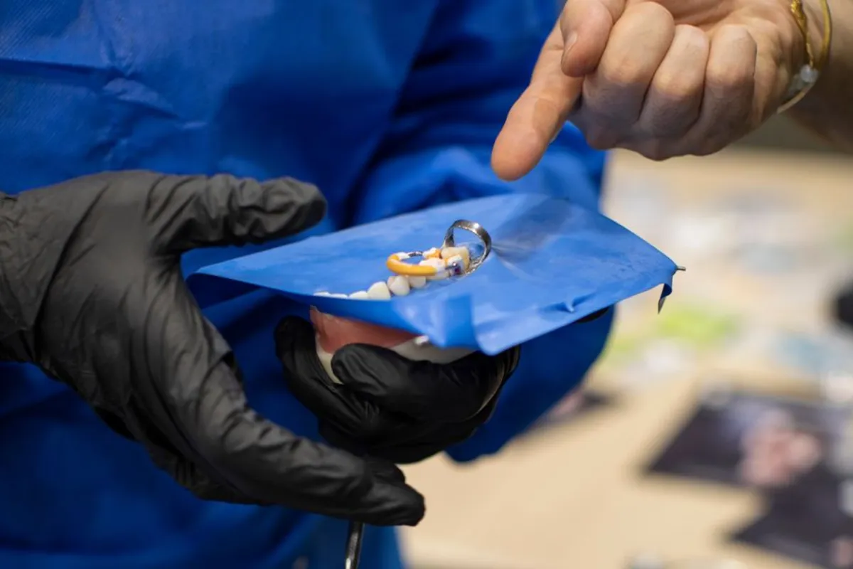 Teaching dental students how to place rubber dam.