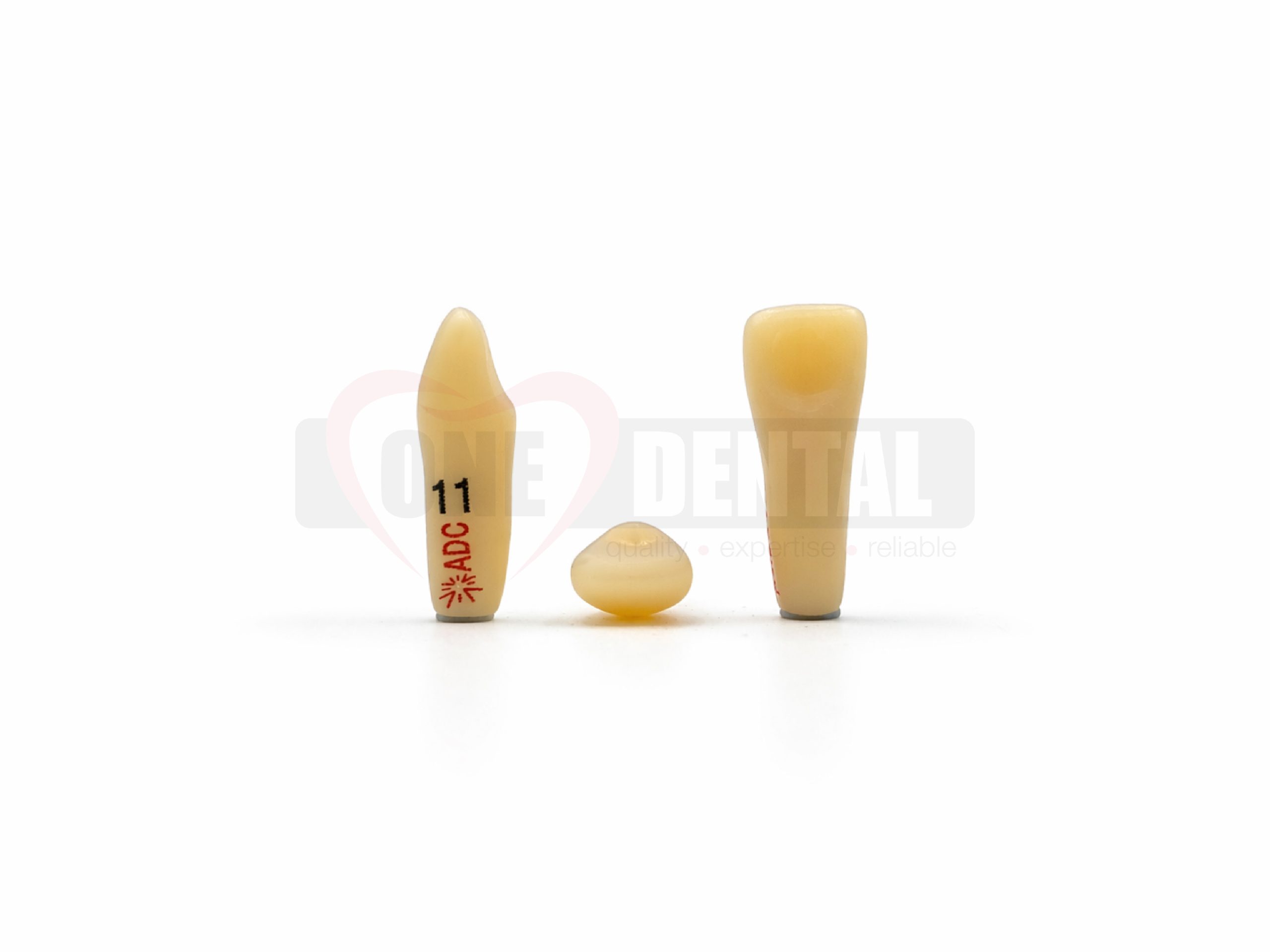 Three beige dental implant models standing upright on a white surface, viewed from the front.